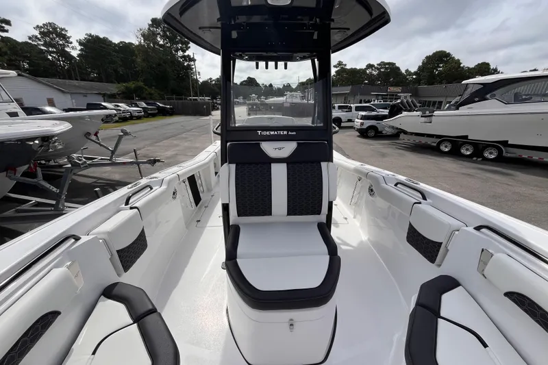 Slide: The Image of 2026 Tidewater 256 CC Adventure boat interior with sleek seating and modern design. - 12
