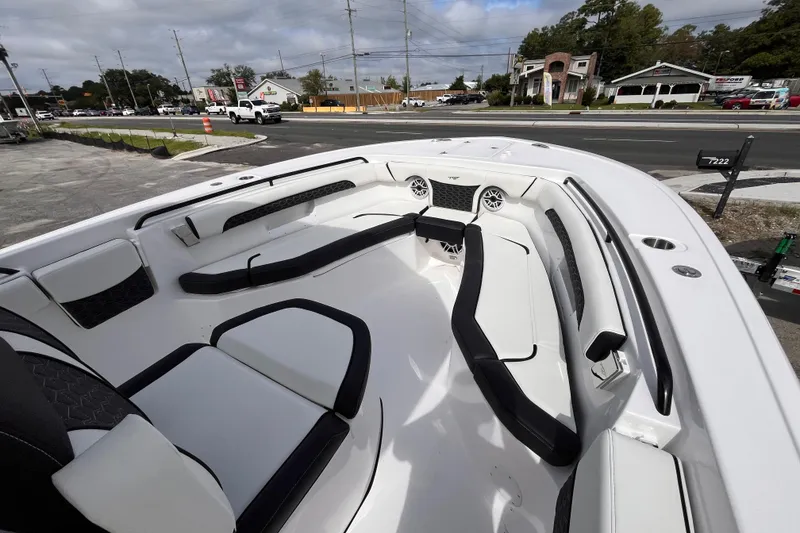 Slide: The Image of 2026 Tidewater 256 CC Adventure boat interior with sleek seating and modern design. - 13