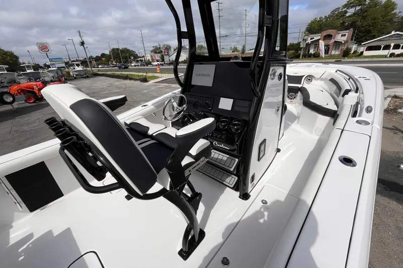 Slide: The Image of 2026 Tidewater 256 CC Adventure boat interior with modern console and seating. - 15