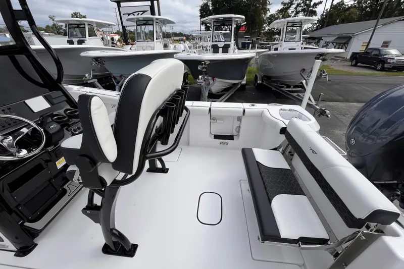 Slide: The Image of 2026 Tidewater 256 CC Adventure boat interior with seating and control panel. - 7