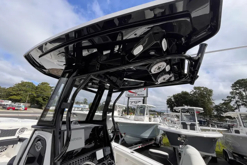 Slide: The Image of 2026 Tidewater 256 CC Adventure boat with advanced navigation and sleek design. - 9