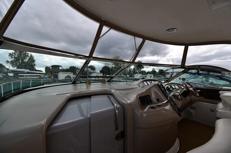 Slide: The Image of Interior view of 2003 Sea Ray 460 Sundancer yacht cockpit with panoramic windows. - 10
