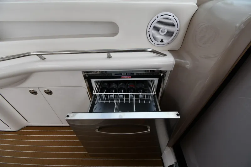 Slide: The Image of Open drawer with wine bottles on a 2003 Sea Ray 460 Sundancer yacht. - 32