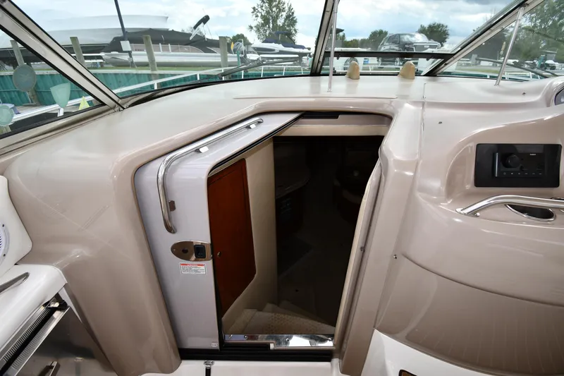 Slide: The Image of 2003 Sea Ray 460 Sundancer cabin entrance with open door, showcasing interior access. - 33