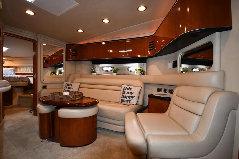 Slide: The Image of Luxurious interior of 2003 Sea Ray 460 Sundancer yacht with plush seating and elegant wood finishes. - 44