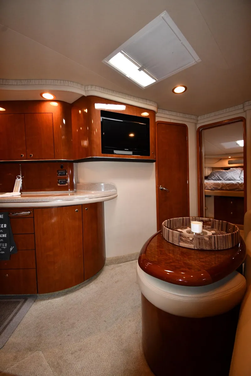 Slide: The Image of Luxurious interior of 2003 Sea Ray 460 Sundancer yacht with wood cabinetry and modern amenities. - 47