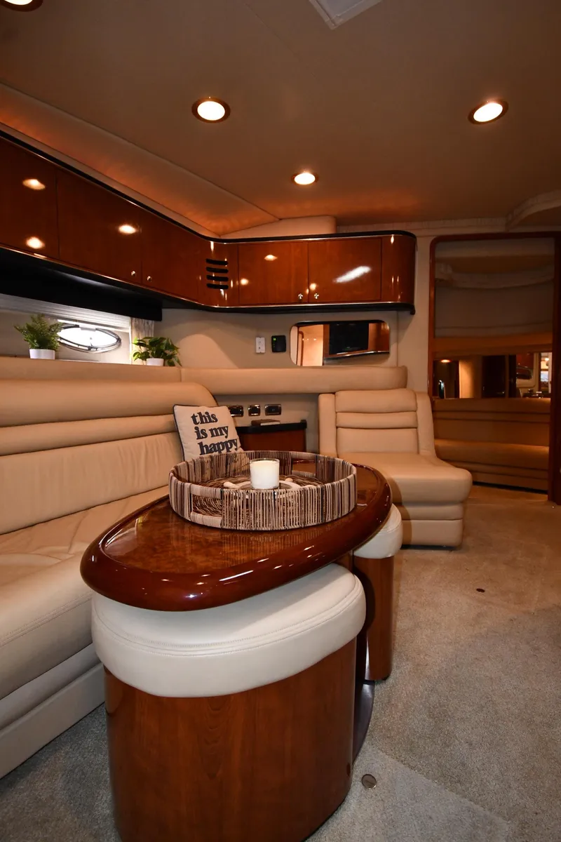 Slide: The Image of Luxurious interior of 2003 Sea Ray 460 Sundancer yacht with elegant seating and wooden finishes. - 51