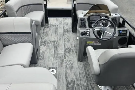 Slide: The Image of 2022 Apex Marine Qwest boat interior with gray seating and modern dashboard. - 4