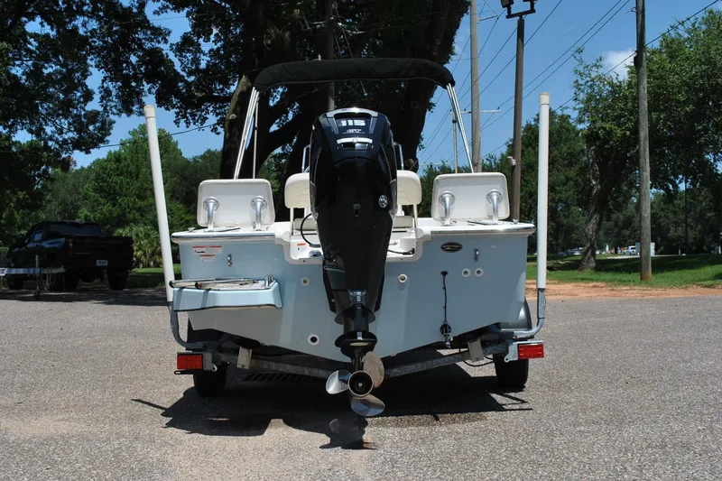Slide: The Image of 2018 Boston Whaler 170 Montauk boat on trailer, rear view with outboard motor. - 15