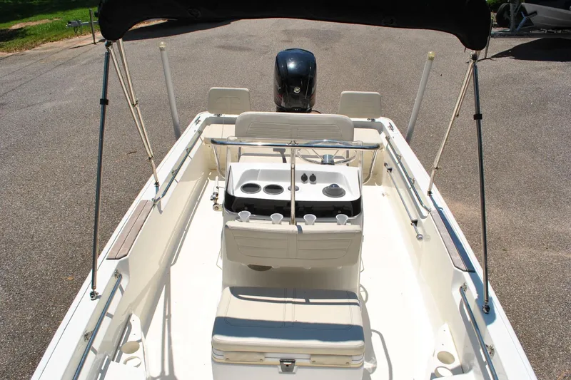 Slide: The Image of 2018 Boston Whaler 170 Montauk boat interior with steering console and seating. - 16