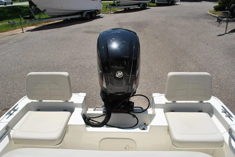 Slide: The Image of 2018 Boston Whaler 170 Montauk boat with Mercury outboard motor, rear seating view. - 19