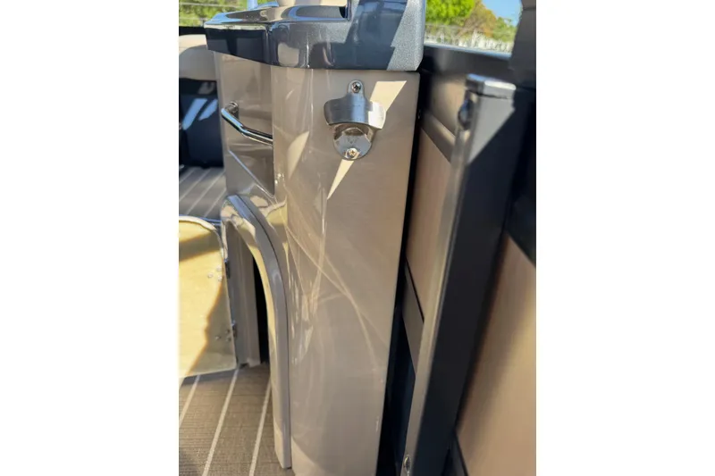 Slide: The Image of 2022 Viaggio Diamante B boat interior with sleek cabinetry and bottle opener. - 21