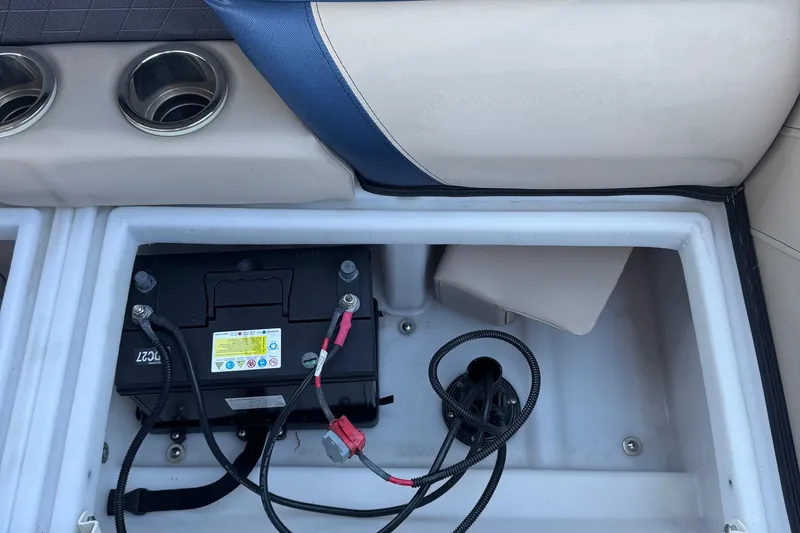 Slide: The Image of Battery compartment of 2022 Viaggio Diamante B boat, featuring wiring and cup holders. - 26