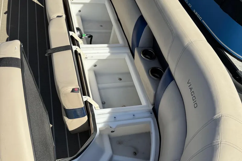 Slide: The Image of 2022 Viaggio Diamante B boat interior with storage compartments and cup holders. - 30