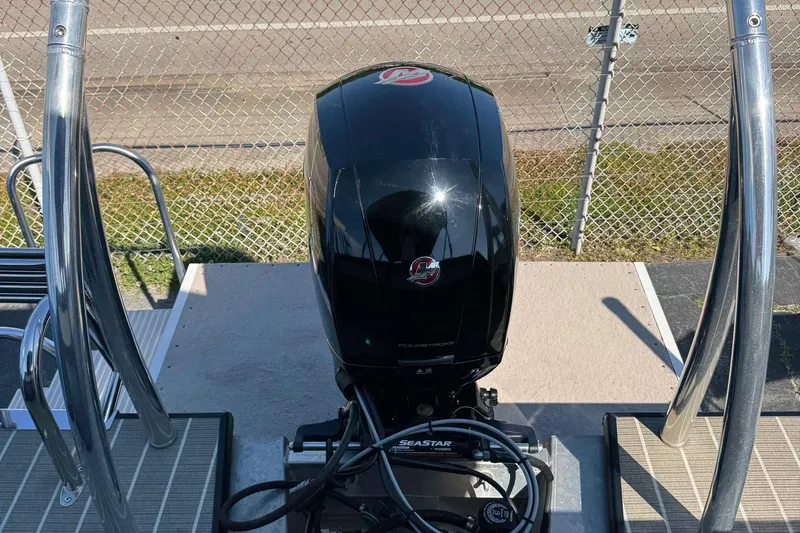 Slide: The Image of 2022 Viaggio Diamante B boat engine with chrome railings, parked near a chain-link fence. - 38