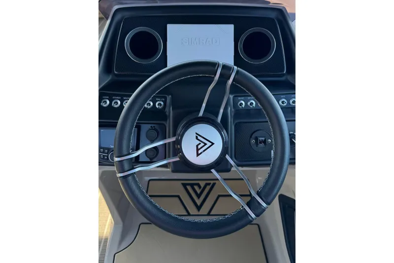 Slide: The Image of 2022 Viaggio Diamante B steering wheel and dashboard with modern controls. - 9