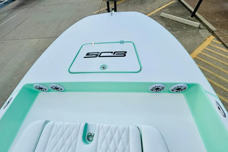 Slide: The Image of 2026 SCB R24 boat deck with speakers and seating, showcasing modern design. - 14