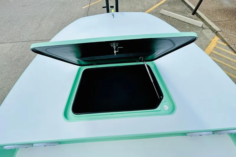 Slide: The Image of 2026 SCB R24 boat with sleek design and modern features, parked outdoors. - 15