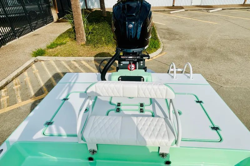 Slide: The Image of 2026 SCB R24 boat on trailer, featuring sleek design and powerful engine, parked outdoors. - 6