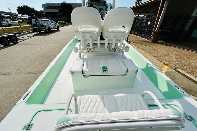 Slide: The Image of 2026 SCB R24 boat with outboard motor in parking lot. - 8