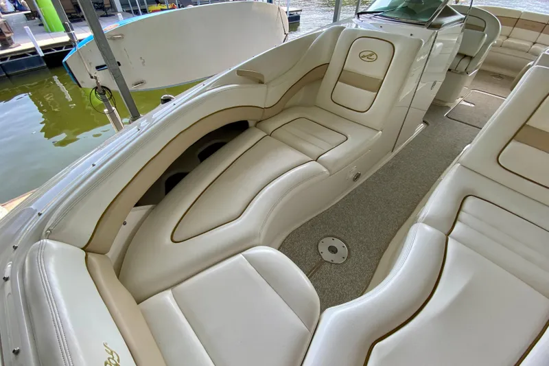 Slide: The Image of Luxurious interior of a 2002 Sea Ray 290 SLX boat with plush seating. - 20