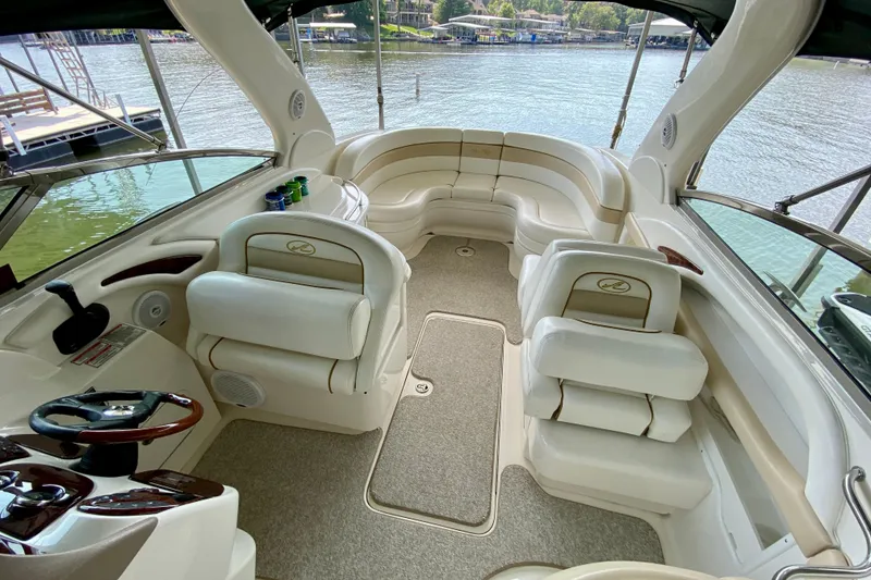 Slide: The Image of Interior of a 2002 Sea Ray 290 SLX boat with plush seating and elegant design. - 8