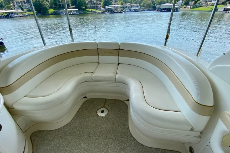 Slide: The Image of Luxurious seating on 2002 Sea Ray 290 SLX boat, overlooking serene waterfront. - 9