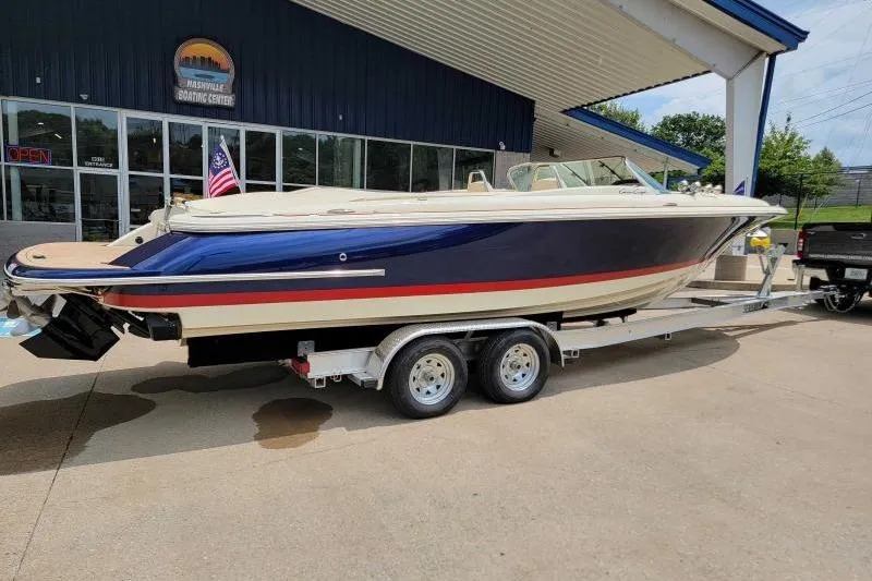 Slide: The Image of 2024 Chris-Craft Launch 27 boat on trailer at dealership. - 1