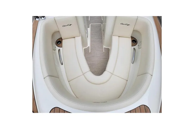 Slide: The Image of 2024 Chris-Craft Launch 27 boat interior with elegant cream seating and wood accents. - 12