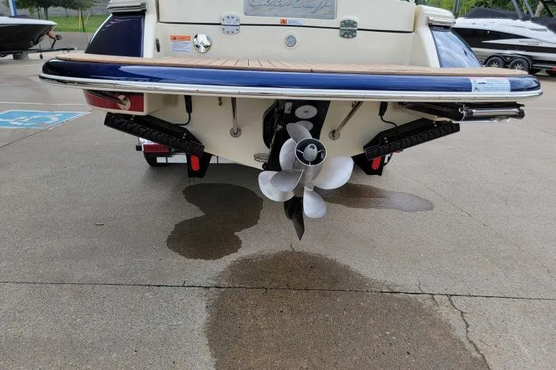 Slide: The Image of 2024 Chris-Craft Launch 27 boat stern view with propeller and swim platform. - 16