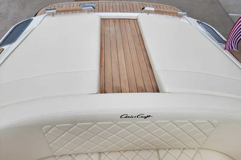Slide: The Image of 2024 Chris-Craft Launch 27 boat with teak deck and cream upholstery. - 19