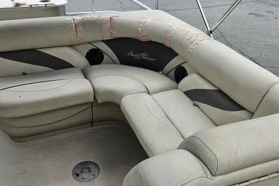 Slide: The Image of 2014 SunChaser Classic Fish 8522 4-PT boat seating with visible wear and tear. - 15