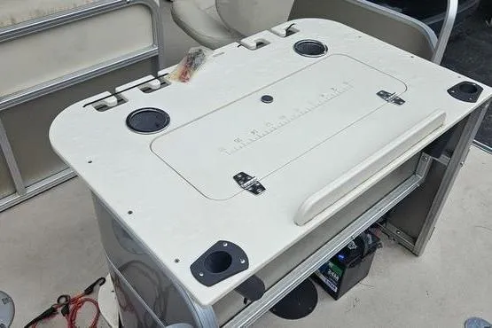 Slide: The Image of 2014 SunChaser Classic Fish 8522 4-PT boat console with cup holders and storage. - 17