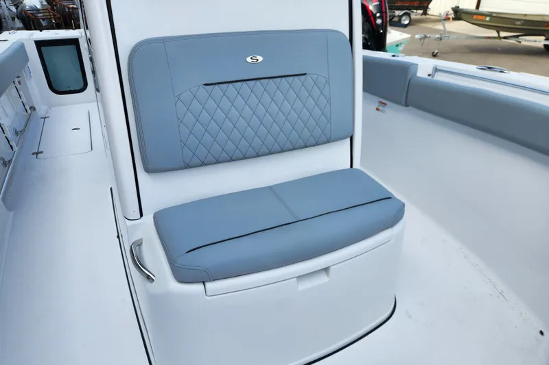 Slide: The Image of 2026 Sportsman Open 252 Center Console boat seat with blue cushioned upholstery. - 7
