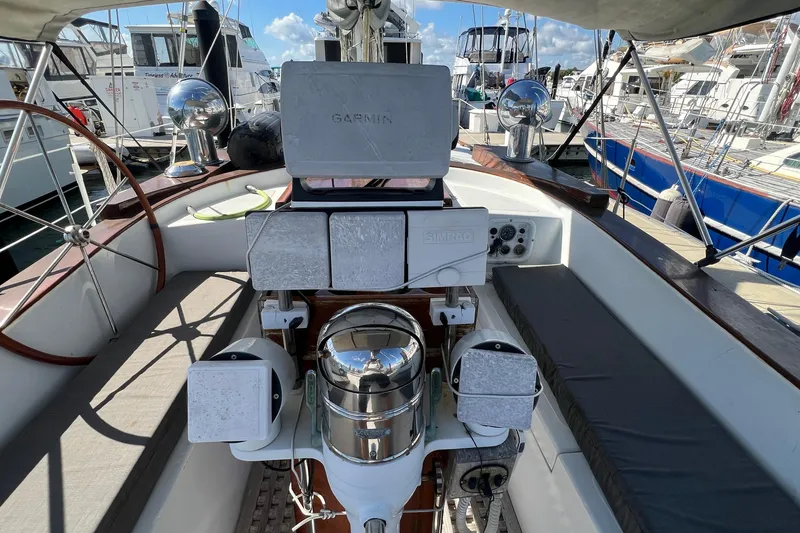 Slide: The Image of Cockpit of a 1977 Gulfstar 50 sailboat with navigation equipment and seating. - 11