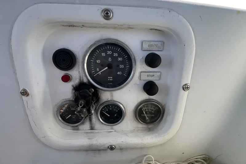 Slide: The Image of 1977 Gulfstar 50 control panel with gauges and start-stop buttons. - 14