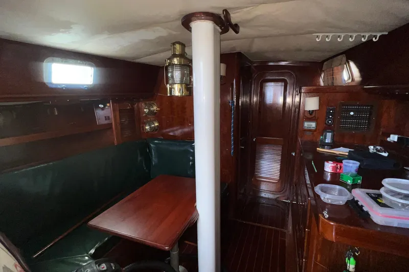 Slide: The Image of Interior of a 1977 Gulfstar 50 sailboat with wooden furnishings and nautical decor. - 26
