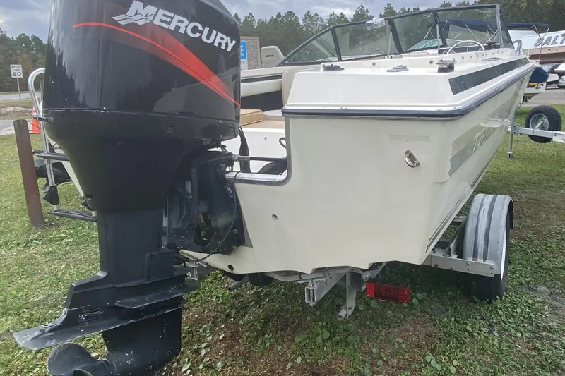 Slide: The Image of 1979 Regal 1800 Bowrider with Mercury outboard motor on trailer. - 5