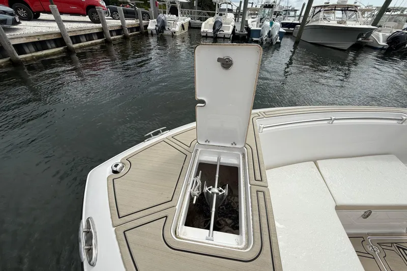 Slide: The Image of Open anchor compartment on 2023 LFG 22 boat docked at marina. - 5