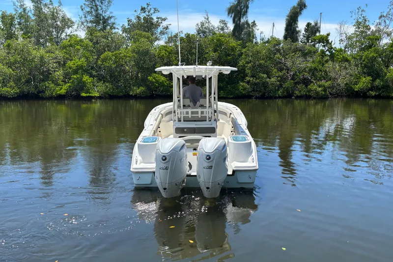 Slide: The Image of 2026 Key West 260 CC boat with dual engines on a calm river. - 3