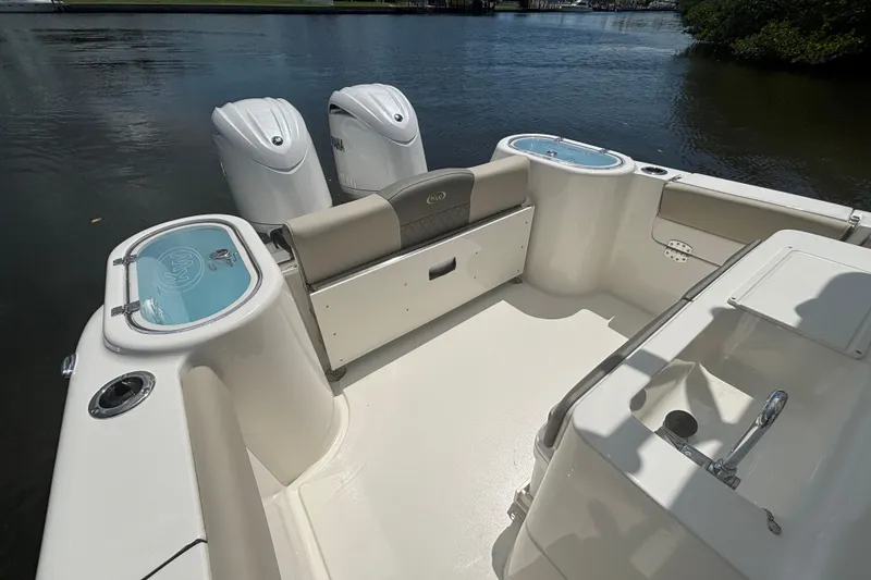 Slide: The Image of 2026 Key West 260 CC boat interior with dual engines on calm water. - 6