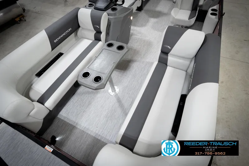 Slide: The Image of 2026 Bennington 20 SSR pontoon boat with red canopy in showroom. - 10