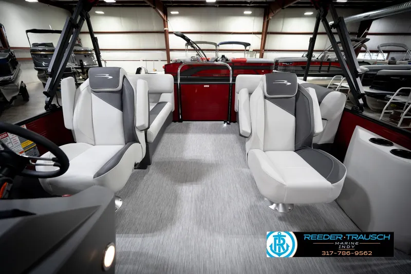Slide: The Image of 2026 Bennington 20 SSR pontoon boat interior with gray seating and central table. - 15