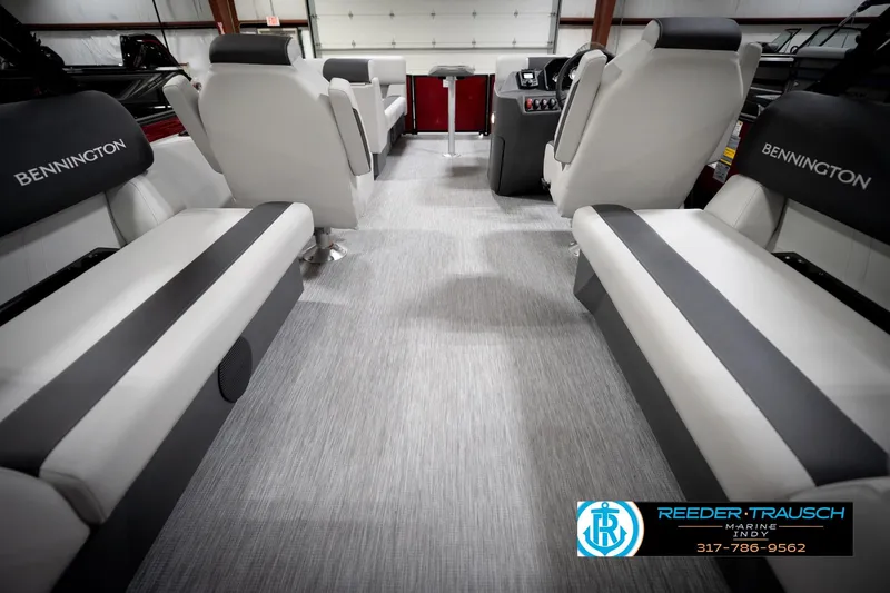 Slide: The Image of Interior of 2026 Bennington 20 SSR pontoon boat with gray seating and red accents. - 17