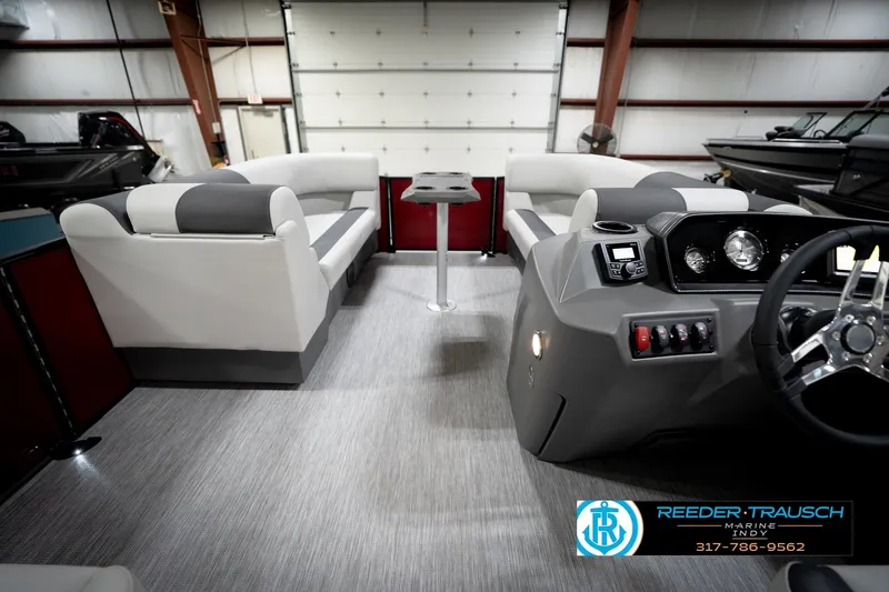 Slide: The Image of Interior of a 2026 Bennington 20 SSR pontoon boat with luxurious seating. - 18