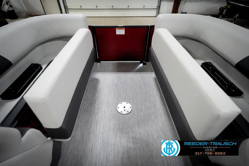 Slide: The Image of Interior of a 2026 Bennington 20 SSR pontoon boat with gray seating and flooring. - 21