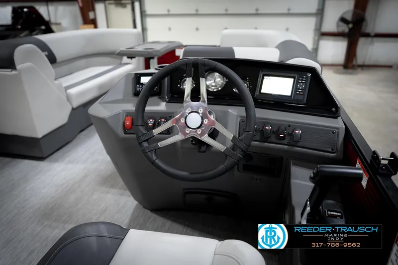 Slide: The Image of 2026 Bennington 20 SSR pontoon boat interior with gray seating and red gate. - 28