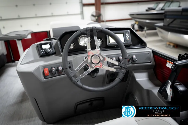 Slide: The Image of 2026 Bennington 20 SSR boat interior with steering wheel and control panel. - 29