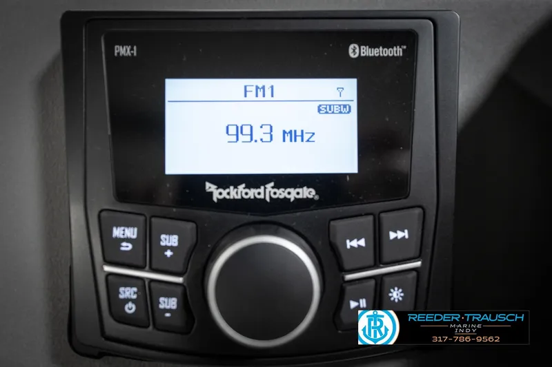 Slide: The Image of Control panel of 2026 Bennington 20 SSR boat with horn, radio, navigation, and dock light switches. - 32