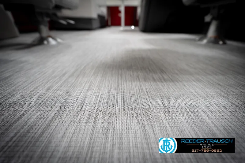 Slide: The Image of 2026 Bennington 20 SSR boat interior with gray and white seating, Reeder-Trausch Marine logo. - 44